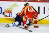 JEFF MCINTOSH / CANADIAN PRESS FILES
                                Dylan DeMelo (left) is checked by forward Radim Zohorna during the first period in Calgary Friday night.