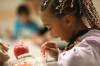 RUTH BONNEVILLE / WINNIPEG FREE PRESS
                                LOCAL - hot lunches Grade 2 student, Tahani, enjoys her fresh carrots inside her hot bagged lunch at Westgrove School Monday. HOT LUNCHES: Winnipeg’s Oasis Church along with provides 70 meals to Westgrove School students each and every week day as part of a community initiative to ensure students are fed healthy meals. Church coordinator Tom Cooney, helps hand out the lunches. organize the volunteers and even deliverer the food to the school. Maggie Macintosh Education Reporter - Winnipeg Free Press Oct 17th, 2022