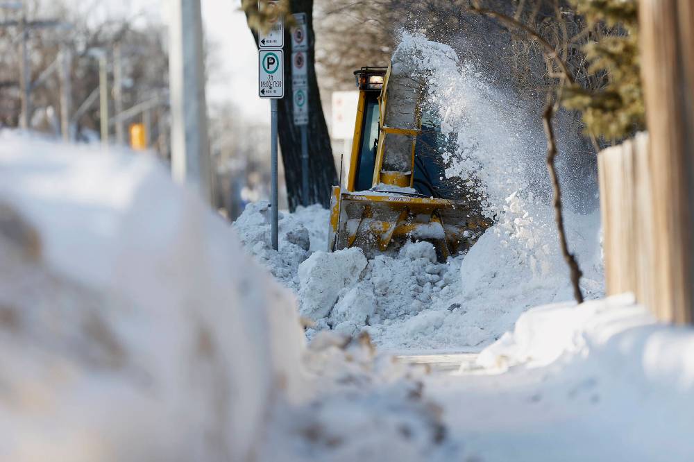 JOHN WOODS / WINNIPEG FREE PRESS FILES
                                Sidewalk clearing was particularly challenging last winter.