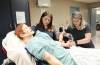 Red River College Polytechnic second-year nursing students Melissa Ciurko (left) and Jenna Forsyth assess a high-fidelity simulated mannequin named Jacob in their department on Tuesday. (Ruth Bonneville / Winnipeg Free Press)