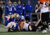 THE CANADIAN PRESS/John Woods
                                Blue Bombers Jake Thomas (95) and Jackson Jeffcoat (94) jump on B.C. Lions quarterback Nathan Rourke&rsquo;s fumble during the first half.