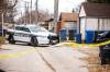 The taped-off crime scene included properties in the back lane of Johnson Avenue West. (Mikaela MacKenzie / Winnipeg Free Press)