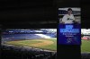 An image of Skip Schumaker, new manager of the Miami Marlins baseball team, is broadcast on a screen inside loanDepot Park, Thursday, Nov. 3, 2022, in Miami. (AP Photo/Rebecca Blackwell)