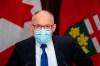 Chief medical officer of health Dr. Kieran Moore holds a news conference in Toronto on Wednesday, March 9, 2022. Moore has said he would recommend masking in certain indoor settings if hospitals began cancelling surgeries. THE CANADIAN PRESS/Nathan Denette