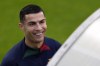 Cristiano Ronaldo smiles as he arrives for a Portugal soccer team training session in Oeiras, outside Lisbon, Monday, Nov. 14, 2022. Portugal will play Nigeria Thursday in a friendly match in Lisbon before departing to Qatar on Friday for the World Cup. (AP Photo/Armando Franca)