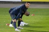 Cristiano Ronaldo stretches with teammate Pepe, in the background, during a Portugal soccer team training session in Oeiras, outside Lisbon, Monday, Nov. 14, 2022. Portugal will play Nigeria Thursday in a friendly match in Lisbon before departing to Qatar on Friday for the World Cup. (AP Photo/Armando Franca)