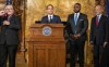 Pennsylvania Gov.-elect Josh Shapiro, at podium, and Lt. Gov.-elect Austin Davis, second right, join Gov. Tom Wolf, right, to announce steps in the transition between administrations during a news conference at the state Capitol in Harrisburg, Pa., on Wednesday, Nov. 16, 2022. (Dan Gleiter/The Patriot-News via AP)