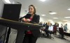 Secretary of State Shenna Bellows looks towards a monitor and camera as she speaks to the public during a Facebook Live feed that was part of the ranked choice tabulations at the Maine State Office building in Augusta, Maine, on Tuesday, Nov. 15, 2022. (Rich Abrahamson/The Central Maine Morning Sentinel via AP)