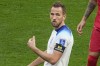 England's Harry Kane gestures wearing a black armband with a sign 