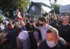 Liberal Leader Justin Trudeau is escorted by his RCMP security detail as protesters shout and throw rocks while leaving a campaign stop at a local micro brewery during the Canadian federal election campaign in London Ont., on Monday, September 6, 2021. THE CANADIAN PRESS/Nathan Denette