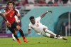 Canada forward Alphonso Davies (19) gets tripped up as Belgium midfielder Axel Witsel (6) looks on during second half Group F World Cup soccer action at Ahmad bin Ali Stadium in Al Rayyan, Qatar, on Wednesday, Nov. 23, 2022. THE CANADIAN PRESS/Nathan Denette