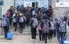 Students enter the Pierre Laporte Secondary School as secondary school students return to class full time during the COVID-19 pandemic in Montreal, on Monday, March 29, 2021. The Alberta government says school boards can't require students to wear masks in school or be forced to take classes online.THE CANADIAN PRESS/Paul Chiasson