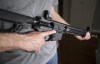 A restricted gun licence holder holds a AR-15 at his home in Langley, B.C. on May 1, 2020. A firearm advocacy group says the Liberal government's effort to ban a wide variety of rifles is being driven by ideology, not public safety.THE CANADIAN PRESS/Jonathan Hayward