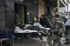 FILE - Ukrainian soldiers carry a wounded soldier into a hospital in Bakhmut, Donetsk region, Ukraine, Friday, Nov. 11, 2022. A top adviser to Ukraine's president has cited military chiefs as saying 10,000 to 13,000 Ukrainian soldiers have been killed in the country's nine-month struggle against Russia's invasion, a rare comment on such figures and far below estimates of Ukrainian casualties from Western leaders. Late Thursday, Dec. 1, 2022, Mykhailo Podolyak, a top adviser to Ukrainian President Volodymyr Zelenskyy, relayed new figures about Ukrainian soldiers killed in battle, while noting that the number of injured troops was higher and civilian casualty counts were “significant.” (AP Photo/Libkos, File)