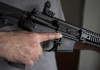 A restricted gun licence holder holds a AR-15 at his home in Langley, B.C. Friday, May 1, 2020. Prime Minister Justin Trudeau says he's listening to concerns that some of the firearms his government is looking to ban are in fact used more for hunting. THE CANADIAN PRESS/Jonathan Hayward