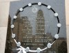 The tower of the University de Montreal is reflected in the school's memorial plaque that names the 14 victims on the 30th anniversary of the 1989 Ecole Polytechnique attack on Friday, December 6, 2019 in Montreal.THE CANADIAN PRESS/Ryan Remiorz