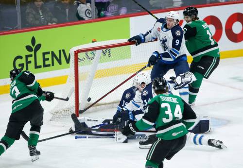 JOHN WOODS / WINNIPEG FREE PRESS
                                Manitoba Moose Leon Gawanke (9) saves the shot from Texas Stars’ Jacob Peterson (13) during first period AHL action in Winnipeg on Sunday.