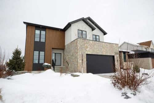 Photos by Mike Deal / Winnipeg Free Press 
                                This large and luxurious Sage Creek home is loaded with style and features.