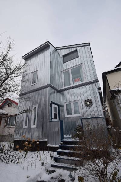 Photos by Todd Lewys / Winnipeg Free Press
                                Built in 1905, this unique home received a vertical addition and was clad in metal in 1984 and has since received many modern updates.