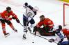 Winnipeg Jets centre Pierre-Luc Dubois (80) works the puck past Chicago Blackhawks defenceman Filip Roos (48) and goaltender Petr Mrazek (34) during the third period Sunday in Chicago. (AP Photo/Matt Marton)