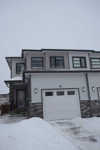 The 1,450 sq. ft., two-storey attached home is in move-in-ready condition with a backyard deck, newer appliances, window coverings, upgraded finishes — and a functional, family-friendly layout.