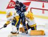 John Woods / The Canadian Press files
                                Kevin Stenlund makes his presence known in the Nashville Predators&rsquo; crease between goalie Juuse Saros and Roland McKeown.