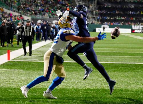 THE CANADIAN PRESS FILES / PAUL CHIASSON
                                Winnipeg Blue Bombers wide receiver Drew Wolitarsky (82) reaches for a pass as Toronto Argonauts defensive back Tarvarus McFadden (20) defends during second half action at the 109th Grey Cup at Mosaic Stadium in November.