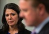 Alberta Premier Danielle Smith watches Minister of Justice and Solicitor General of Alberta Tyler Shandro speak at a press conference after the Speech from the Throne in Edmonton, Tuesday, Nov. 29, 2022. THE CANADIAN PRESS/Jason Franson