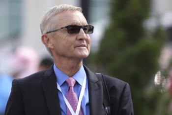 FILE - Trainer Jason Servis stands at Churchill Downs onMay 3, 2019, in Louisville, Ky. Servis, whose horse Maximum Security was the 3-year-old champion in 2019, pleaded guilty Friday, Dec. 9, 2022, to federal charges involving a widespread scheme to drug horses. The New Jersey-based trainer faces four years in prison when he is sentenced next May in U.S. District Court in Manhattan. He was the last defendant facing charges, and now 23 of the 31 individuals charged have pleaded guilty. (AP Photo/Gregory Payan, File)