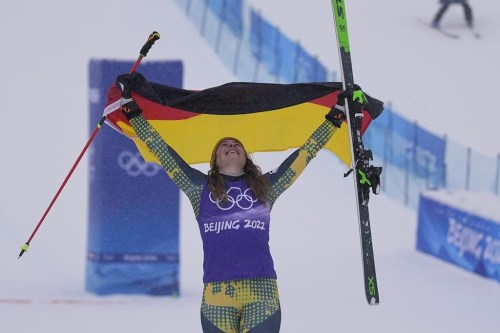 FILE - Bronze medal winner Germany's Daniela Maier celebrates during the venue award ceremony for the women's cross at the 2022 Winter Olympics, Thursday, Feb. 17, 2022, in Zhangjiakou, China. A second bronze medal will be awarded to end a dispute over third place in women’s skicross at the Beijing Olympics. Under a settlement reached 10 months after the race — and following a second change in the result — both Fanny Smith of Switzerland and Daniela Maier of Germany will get a bronze medal. (AP Photo/Gregory Bull, File)