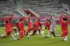 Moroccan players exercise during a training session at the Duhail Stadium in Doha, Qatar, Tuesday, Dec. 13, 2022. Morocco will face France in a World Cup semifinal soccer match on Dec. 14. THE CANADIAN PRESS/AP, Andre Penner