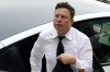 FILE - Elon Musk arrives at the justice center in Wilmington, Del., Tuesday, July 13, 2021. According to a filing posted late Wednesday, Dec. 14, 2022, by the U.S. Securities and Exchange Commission, Musk sold another $3.58 billion worth of Tesla stock during the week, but it wasn’t clear where the proceeds were being spent. Musk has sold nearly $23 billion worth of Tesla stock since April, with much of the money likely going to help fund his $44 billion acquisition of Twitter. (AP Photo/Matt Rourke, File)