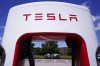 FILE - Tesla Supercharger is seen at Willow Festival shopping plaza parking lot Wednesday, Aug. 10, 2022, in Northbrook, Ill. Shares of Tesla are sliding before the market open on Thursday, Dec. 15, 2022, after news broke that CEO Elon Musk sold another $3.58 billion worth of the electric vehicle maker’s stock this week. (AP Photo/Nam Y. Huh, File)