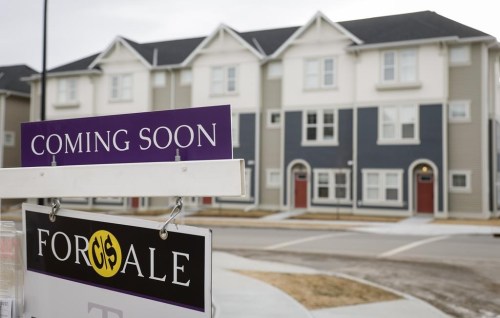 Houses for sale are shown in a new subdivision in Airdrie, Alta., Friday, Jan. 28, 2022. The Canadian Real Estate Association says seasonally adjusted home sales were down 3.3 per cent on a month-over-month basis in November. THE CANADIAN PRESS/Jeff McIntosh