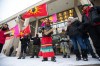 Sue Caribou, centre, sings a song in front of Winnipeg City Hall during a rally, Thursday, Dec. 15, 2022, to call on the city to cease dumping operations at a landfill and conduct a search for the remains of missing and murdered Indigenous women believed to be there. THE CANADIAN PRESS/Daniel Crump