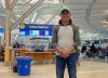 Louie Madlang is pictured at Vancouver International Airport on Friday, Dec. 23, 2022. He, his wife, and five extended family members, arrived Monday Dec. 19 when their connecting flight to Edmonton was cancelled. They weren't able to get a flight out until Christmas.. THE CANADIAN PRESS/Nono Shen