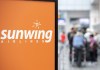 Travellers wait in line at a Sunwing Airlines check-in desk at Trudeau Airport in Montreal, Wednesday, April 20, 2022. Hundreds of Canadians are stranded in Cancún, Mexico and don't know how they'll get home after their Sunwing flights were cancelled last week. THE CANADIAN PRESS/Graham Hughes