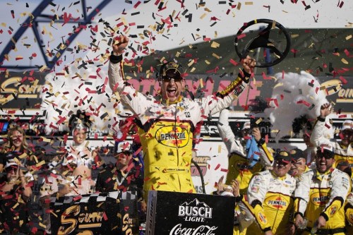 FILE - Joey Logano celebrates after winning a NASCAR Cup Series auto race on Oct. 16, 2022, in Las Vegas. The most meticulously designed and intently controlled racecar in NASCAR history leveled the field in 2022. The so-called Next Gen car resulted in 19 different winners over 36 races and laded two guys their first shot at a championship in the season finale. (AP Photo/John Locher, File)