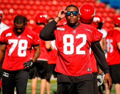 Calgary Stampeders' Nik Lewis, walks off the field during the first day of training camp in Calgary, Alta., Sunday, June 1, 2014. THE CANADIAN PRESS/Jeff McIntosh