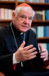 German Cardinal Gerhard Mueller speaks during an interview with The Associated Press in his apartment in Rome, Wednesday, Jan. 4, 2023. Benedict gave his fellow German theologian his old job, as prefect of the Vatican’s doctrine office. He entrusted his life’s theological works to Mueller, who has spent nearly two decades organizing them in a 16-volume, 25,000-page opus along the lines of Thomas Aquinas’ Summa Theologica. He gave him his old flat on the top floor of a Vatican apartment building, where he had lived as Cardinal Joseph Ratzinger. (AP Photo/Domenico Stinellis)