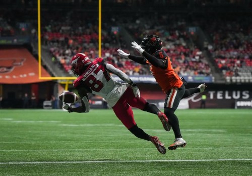 Calgary Stampeders' Richie Sindani (87) fails to hold onto the ball while attempting to make a reception in the end zone as B.C. Lions' T.J. Lee (6) defends during the second half of CFL football game in Vancouver, on Saturday, September 24, 2022. Calgary Stampeders wide receiver Richie Sindani was suspended two games by the CFL on Friday for testing positive for banned substances. The 27-year-old from Regina tested positive for Methandienone and Stanozolol, the league said in a statement. THE CANADIAN PRESS/Darryl Dyck