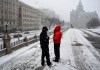 People keep warm in their winter coats as they vape outside Parliament Hill’s West Block as snow falls in Ottawa, on Wednesday, Dec. 15, 2021. Advocates on both sides of the vaping debate say the government must do more to enforce penalties for selling vapes to kids after a review concluded no changes to the legislation were warranted. THE CANADIAN PRESS/Justin Tang