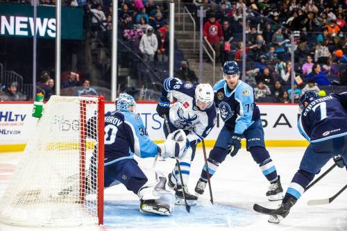 MIKAELA MACKENZIE / WINNIPEG FREE PRESS
                                Manitoba Moose Jacob Friend (48) and Milwaukee Admiral Egor Afanasyev (70) battle in front of the net.