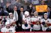 Florida Panthers head coach Paul Maurice (left) and assistant coach Jamie Kompon wave to fans during a break in the action against the Winnipeg Jets. (The Canadian Press)