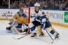 (AP Photo/Jeff Roberson)
                                Winnipeg Jets&rsquo; Kyle Connor handles the puck as St. Louis Blues goaltender Thomas Greiss defends during the first period Thursday in St. Louis.