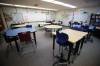 MIKE DEAL / WINNIPEG FREE PRESS
                                A classroom at Darwin School, Wednesday morning where a supplemental HEPA air purifier unit was placed in the gymnasium. The purpose is simply to supplement the air exchange as there is lots of activity in the room. Parents at Darwin School will be relieved to learn the Louis Riel School Division performed an audit of air exchange across schools in 2021-22 to determine where upgrades were necessary. 220907 - Wednesday, September 07, 2022.