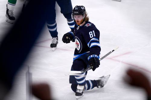 FRED GREENSLADE / THE CANADIAN PRESS
                                Winnipeg Jets’ Kyle Connor (81) celebrates his third goal against the Vancouver Canucks during third period NHL action in Winnipeg on Sunday January 8, 2023.