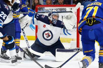 Connor Hellebuyck made 39 saves against the NHL’s highest-scoring team on Thursday. (Jeffrey T. Barnes / The Associated Press)