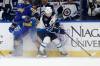 Jeffrey T. Barnes / The Associated Press files
                                Jets defenceman Neal Pionk (right) battles Buffalo Sabres centre Peyton Krebs. Pionk is lacking consistency in his game, but performing well offensively.
