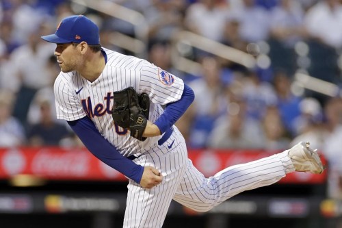 FILE - New York Mets pitcher Adam Ottavino throws during the ninth inning of a baseball game against the Los Angeles Dodgers on Sept. 1, 2022, in New York. The Mets re-signed reliever Ottavino to a two-year contract on Tuesday, Dec. 27, bringing back a top setup man for All-Star closer Edwin Díaz. (AP Photo/Adam Hunger, File)